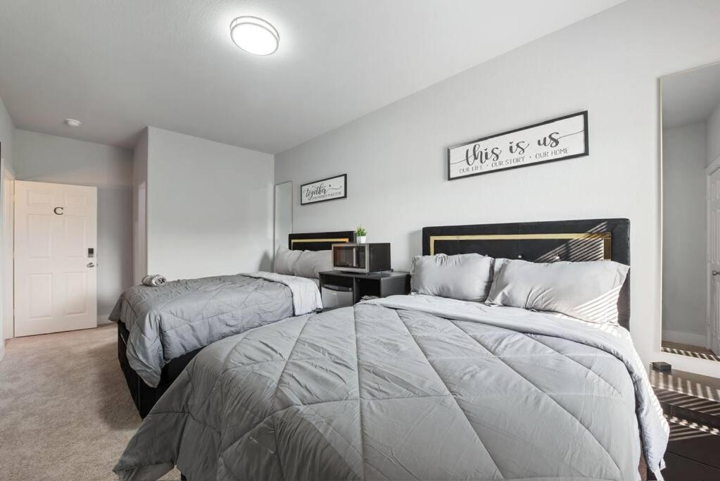 Holiday home Modern 2024 Townhome With Indoor Hoops Huge Tvs And Gray Chic Design
